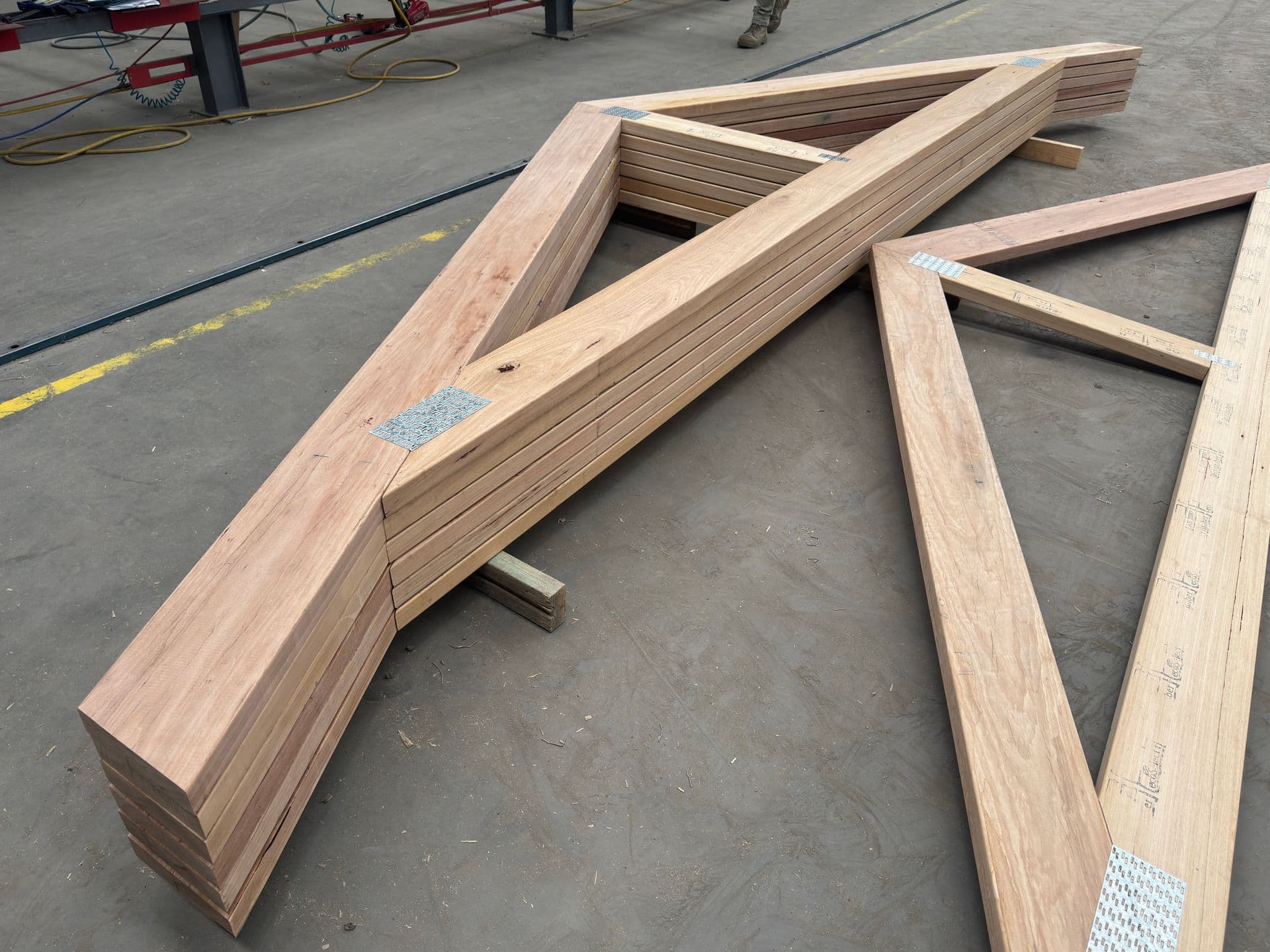 Prefabricated timber roof trusses craned into place on a Melbourne build